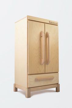 a wooden cabinet with two doors and handles on the front, sitting against a white background