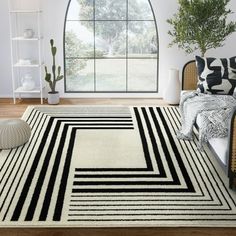 a black and white rug in a living room