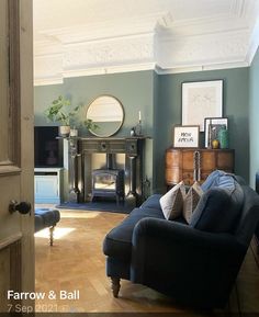 a living room filled with furniture and a fire place