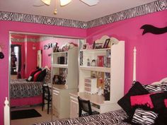 a bedroom with zebra print and pink walls