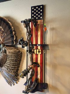 an american flag is hanging on the wall next to some metal items and other things