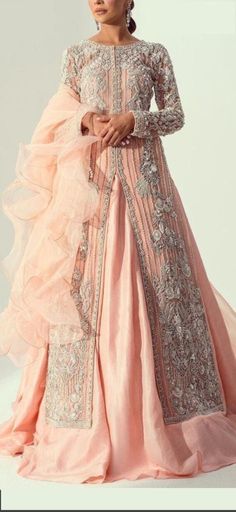 Product Description:  A beautiful Peach wedding oufit featuring luxurious handwork. The arms have beautiful embroidery work on it too. Color: Peach Can be customized in any color Elegant Peach Sharara For Reception, Elegant Peach Sharara With Traditional Drape, Elegant Embroidered Organza Lehenga, Elegant Peach Lehenga With Zari Work, Peach Sharara For Wedding, Elegant Pink Embellished Dupatta, Elegant Semi-stitched Peach Lehenga, Elegant Peach Lehenga With Dupatta, Traditional Drape Peach Dress For Reception