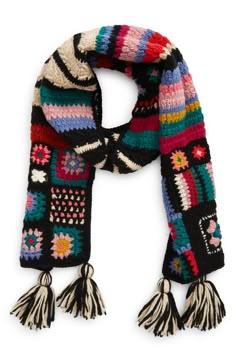 a multicolored knitted scarf with tassels