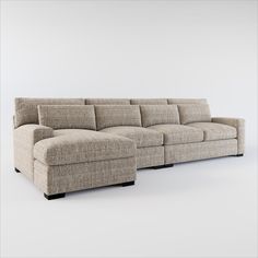 a large sectional couch sitting on top of a white floor