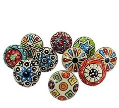 six colorful glass beads with designs on them