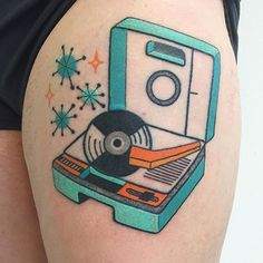 a tattoo with a record player on it