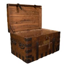 an old wooden trunk is open and empty