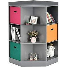 a shelf with four different colored bins on top of it and two stuffed animals