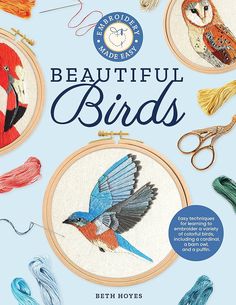 the cover of an embroidery book with birds on it and scissors in front of them