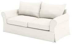 a white couch with two pillows on it's back and the seat folded down