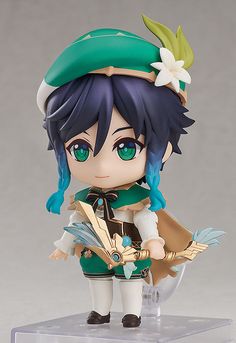 an anime figurine with blue hair and green eyes is standing on a clear base