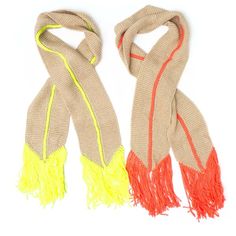 two scarfs with yellow and red fringes on them, one is beige and the other is orange