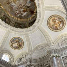 an ornate ceiling with paintings on it