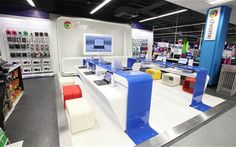 an electronics store is shown with many different colors and designs on the display shelves, along with several electronic devices