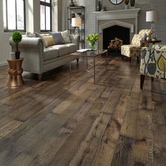 a living room filled with furniture and a fire place