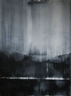 an abstract painting with black and white colors on the wall, it appears to be dark