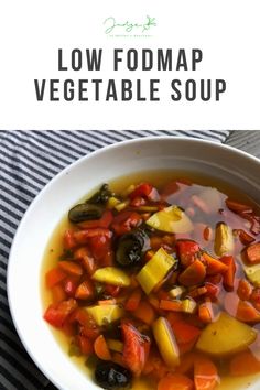 a white bowl filled with vegetable soup on top of a striped table cloth and text overlay reads low fodmap vegetable soup