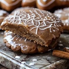 a close up of a cookie with icing and cinnamon