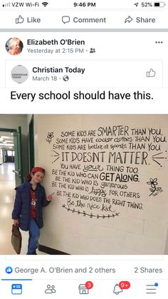 a person standing in front of a wall with writing on it and an instagram