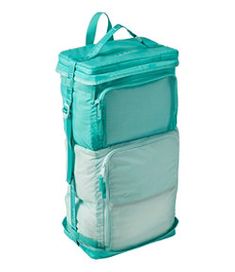 three bags stacked on top of each other with one bag hanging off the side and another in the middle