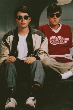 two young men sitting next to each other