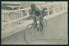 an old photo of a man riding a bike over a bridge in the early 1900's