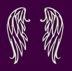 two white angel wings on a purple background with the word love written in large letters