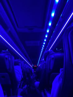 the inside of an airplane with blue lights