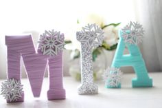 the letters are decorated with snowflakes on them