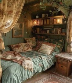 a bed sitting in the middle of a bedroom next to a book shelf filled with books