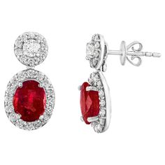 A beautiful and chic pair of drop earrings showcasing brilliant-cut diamonds, and oval-shaped Rubies set in an intricate and stylish design. 2 Diamonds on the top weigh 0.37 carats in total. 2 Rubies weigh 2.32 carats in total. Made in 18k white gold. 52 accent diamonds weigh 0.96 carats in total. The color of these gemstones is ideal, with great luster/shine. Stud earrings. Diamond Drops, Diamond Drop Earrings, Brilliant Cut Diamond, Oval Cut, Stylish Design, Diamond Cuts, Ruby, Jewelry Earrings, White Gold