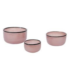 three pink bowls sitting next to each other