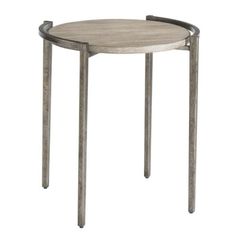 a round wooden table with metal legs