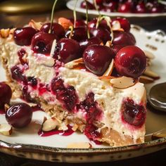 a piece of cheesecake with cherries and almonds