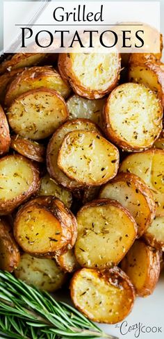 grilled potatoes on a plate with rosemary sprigs