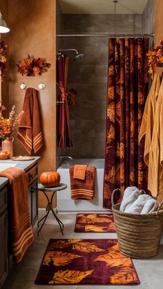 an orange and brown bathroom with towels hanging on the shower curtain, rugs in front of bathtub