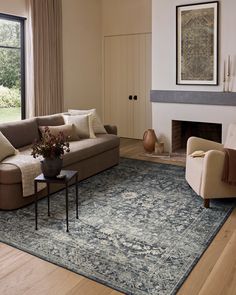 a living room filled with furniture and a fire place next to a large open window