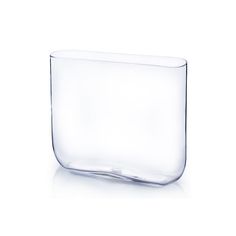 a clear glass vase sitting on top of a white table