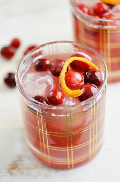 two glasses filled with cranberry orange punch