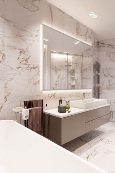 a large bathroom with marble walls and flooring