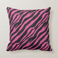 a pink and black zebra print pillow