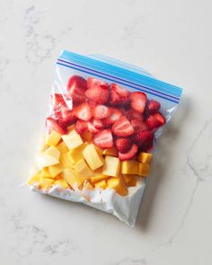 a bag filled with sliced up fruit on top of a counter