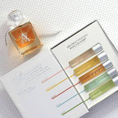 an open box containing three different types of perfumes