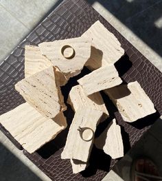 A display made of Travertine Turkish marble fitting for different tasks and items, to present and highlight your decorative objects, art pieces and many other. earring , necklace etc. Size: approximately 5x7x2 cm for each pieces. The item is made of natural stone, which means minor differences in each piece, such as girths, dimples, patterns and etc. Uniqueness is the essence of beauty, isn't it? Travertine Jewellery Display, Turkish Marble, Objects Art, Photo Cubes, Stone Blocks, Jewelry Displays, Set Jewelry, Raw Stone, Jewellery Display