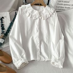 Long sleeve blouse with a frilly peter pan collar with floral eyelet trims and cuffs. S: 13.5" across shoulders, 36" chest, 22" length M: 14" across shoulders, 37.5" chest, 22.5" length L: 14.5" across shoulders, 39" chest, 23" length XL: 15" across shoulders, 40.5" chest, 23.5" length Collar Blouse Outfit, Thrifting Manifestation, Peterpan Collar, Victorian Shirt, White Collared Blouse, Frilly Top, Peter Pan Collar Shirt, Collard Shirt, Peter Pan Collar Blouse