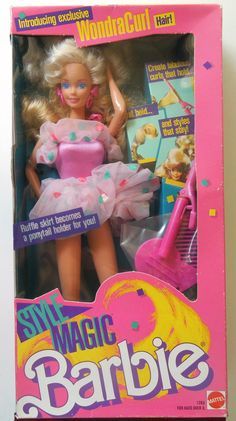 the barbie doll is wearing a pink dress