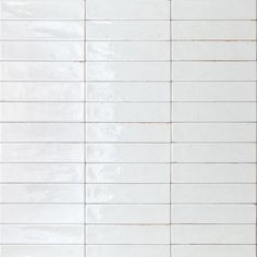 a white tile wall with lines on it