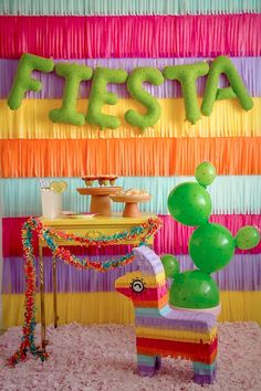 an instagramted photo with the words fiesta on it and balloons in the background