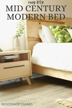 a wooden bed with white sheets and pillows