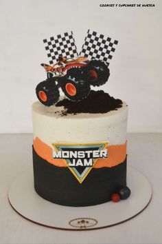 a monster truck cake with dirt on top and the words monster jam written on it